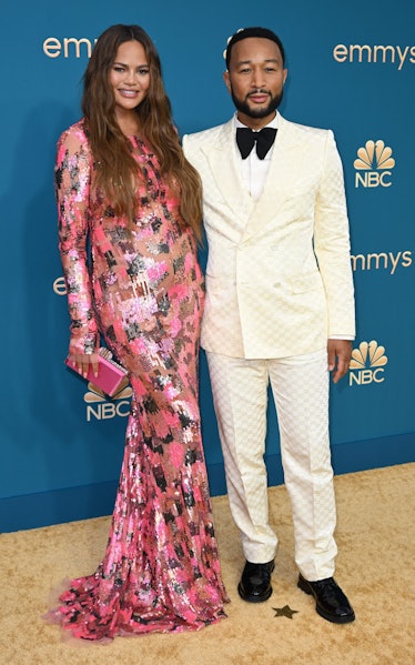 John Legend(R) and Chrissy Teigen arrive for the 74th Emmy Awards