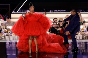 Lizzo and host Kenan Thompson speak onstage during the 74th Primetime Emmys at Microsoft Theater on ...
