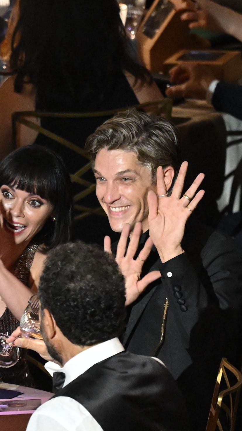 US actress Christina Ricci (L) and husband Mark Hampton wave at the start of the 74th Emmy Awards at...