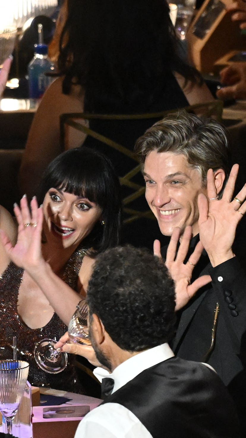 US actress Christina Ricci (L) and husband Mark Hampton wave at the start of the 74th Emmy Awards at...