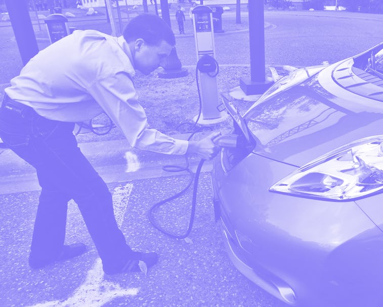 Jukka Kukkonen, of St. Paul, charged his Nissan Leaf all-electric car at a chargining station at the...