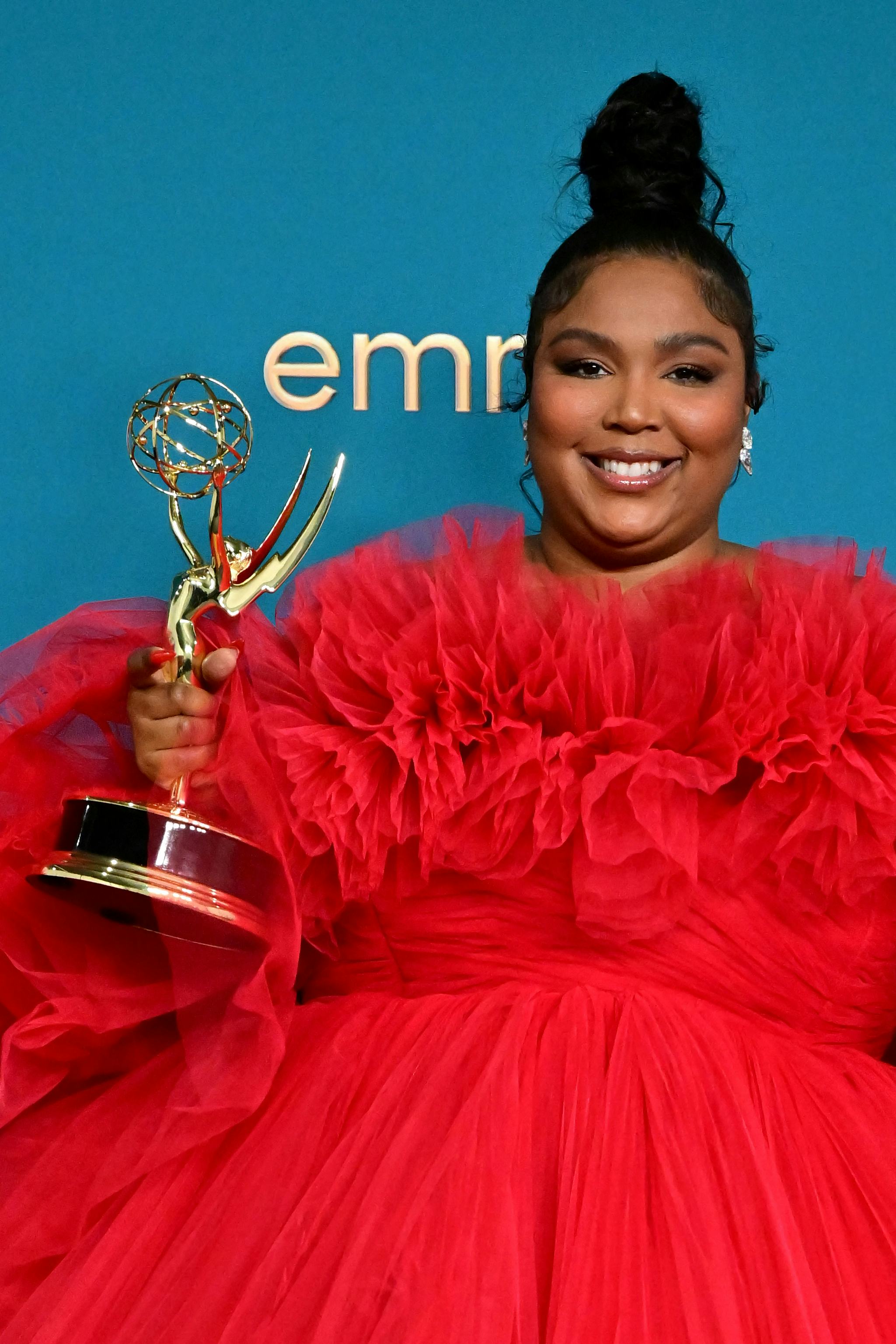 US singer-songwriter Lizzo poses with the Emmy for Outstanding Competition Program for "Lizzo's Watc...