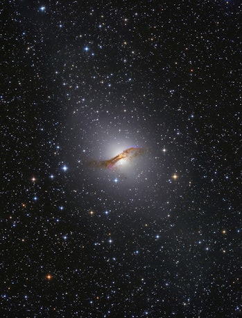 Radio galaxy NGC 5128 in the constellation Centaurus.  The galactic center contains a supermassive...