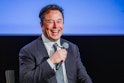 Tesla CEO Elon Musk smiles as he addresses guests at the Offshore Northern Seas 2022 (ONS) meeting i...