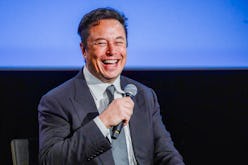 Tesla CEO Elon Musk smiles as he addresses guests at the Offshore Northern Seas 2022 (ONS) meeting i...