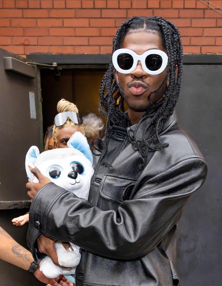 Lil Nas X made his NYFW runway debut and is seen leaving the Coach 1941 fashion show during Septembe...