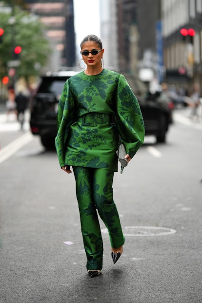 Thassia Naves in a green suit at New York Fashion Week.