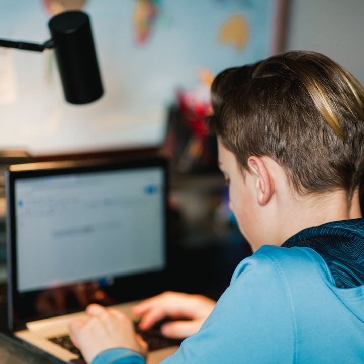 Middle School boy doing homework on computer. Eight 7th grade boys created a "pedo database" to trac...