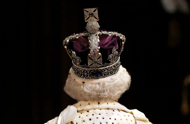 Queen Elizabeth II proceeds through the Royal Gallery before the State Opening of Parliament at the ...