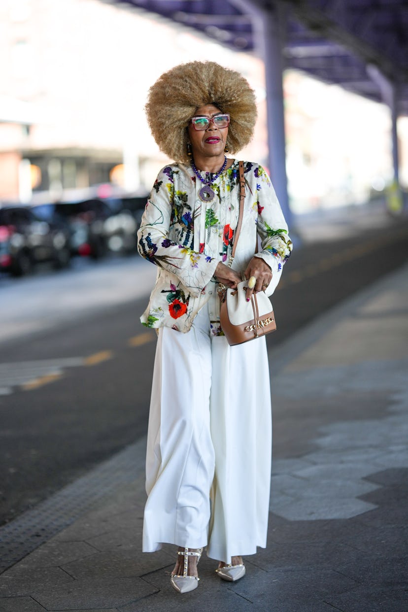 A guest wears white, oversized pants during New York Fashion Week.