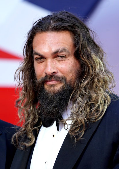 Jason Momoa's hair evolution includes ombre blond hair as seen when Jason Momoa attended the World P...