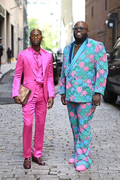 Robert Pauley III and Ramil 'Ramillionaire' Carr in suits at New York Fashion Week.