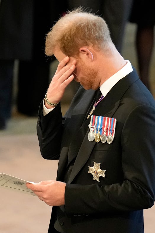 Prince Harry attending a service for the reception of Queen Elizabeth II's coffin at the Palace of W...