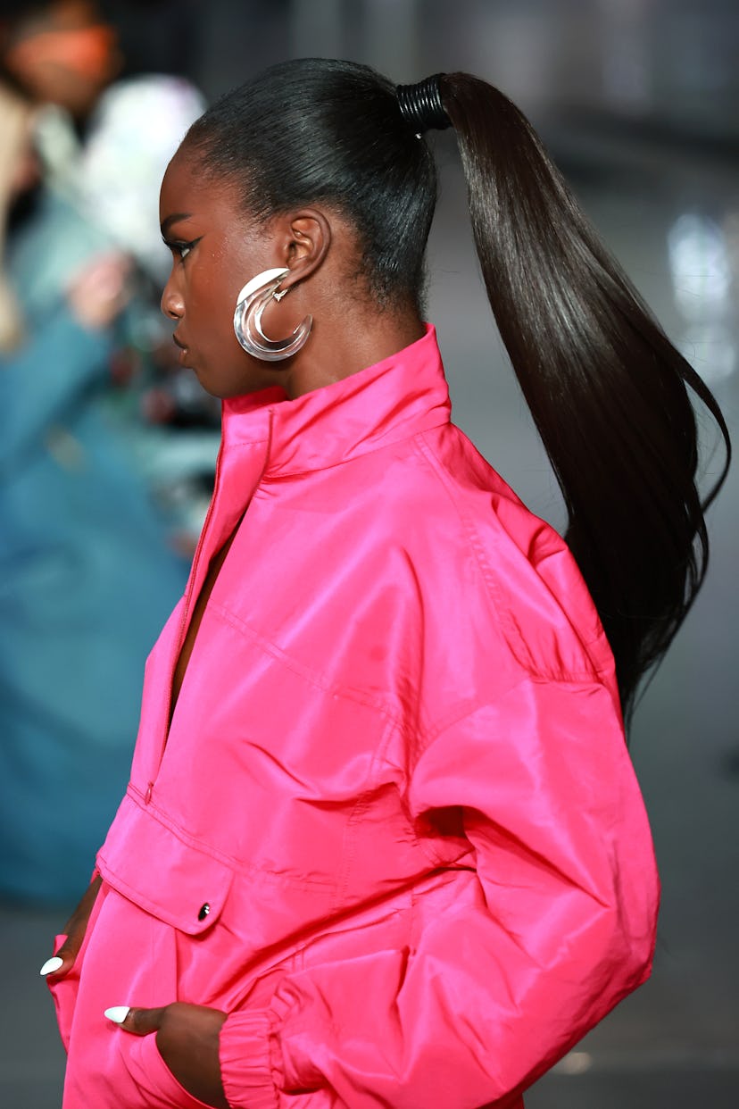 Leomie Anderson walks the runway at the Laquan Smith NYFW SS 2023 fashion show, where Larry Sims sty...