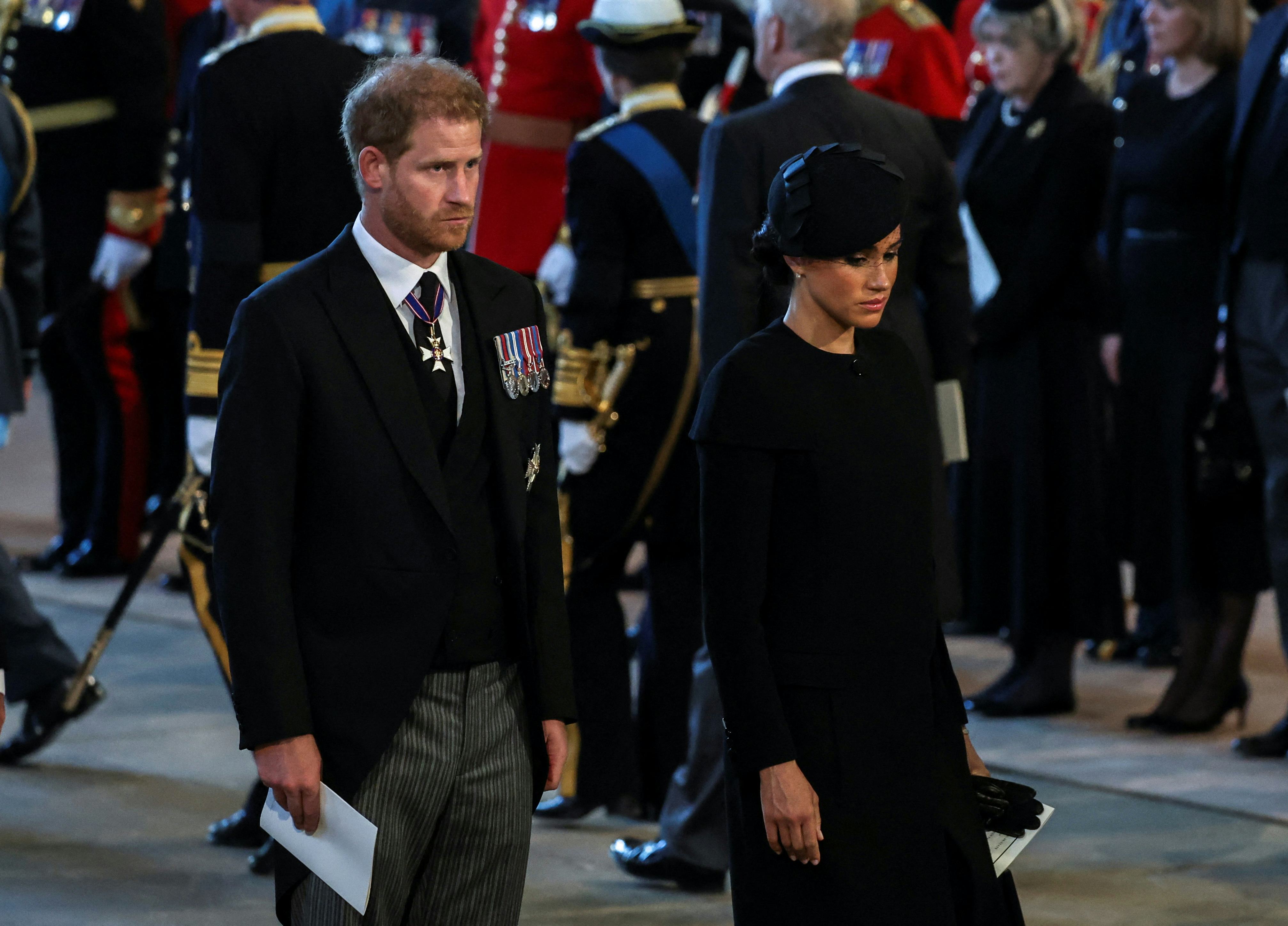 Prince Harry and Meghan in England for the official mourning period for Queen Elizabeth II, who died...