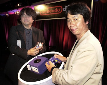 Shigeru Miyamoto (R),  legendary Japanese game designer and Director of Nintendo Co., Ltd., demonstr...