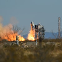 A Blue Origin New Shepard rocket launches from Launch Site One in West Texas, north of Van Horn, on ...