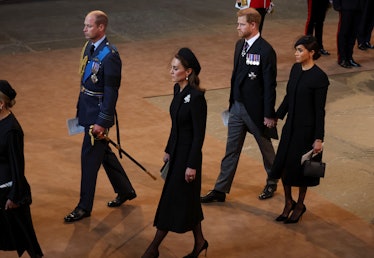 Prince William, Princess Kate, Prince Harry, and Meghan Markle walked in the procession for Queen El...