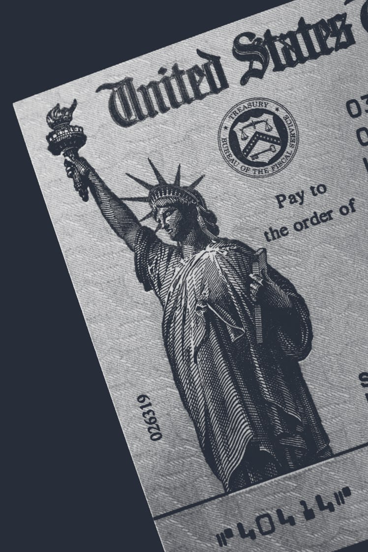 The left, upper corner of a stimulus check with Lady Liberty embossed on the check