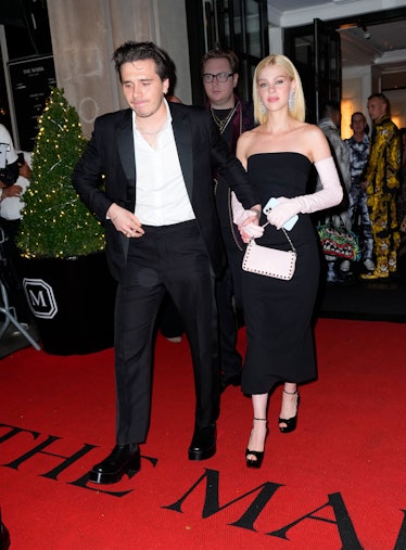 Nicola Peltz Style Evolution: Brooklyn Beckham and Nicola Peltz, in a black dress and opera gloves, ...