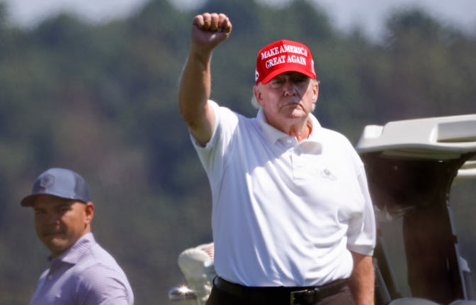 STERLING, VIRGINIA - SEPTEMBER 13: Former U.S. President Donald Trump gestures while golfing at Trum...