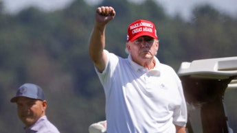 STERLING, VIRGINIA - SEPTEMBER 13: Former U.S. President Donald Trump gestures while golfing at Trum...