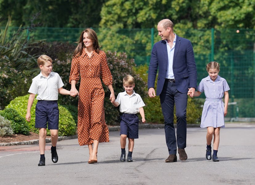 Prince George, Princess Charlotte and Prince Louis (C), accompanied by their parents the Prince Will...