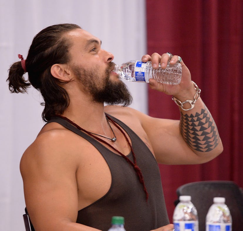 Before Jason Momoa's head tattoo, Jason Momoa showed off his arm tattoo while attending Florida Supe...