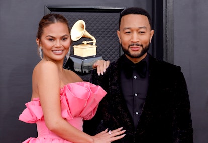Chrissy Teigen and John Legend attend the 64th Annual GRAMMY Awards.