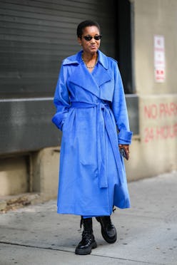 Tamu McPherson in blue trench