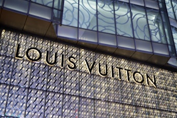 CHONGQING, CHINA - SEPTEMBER 22, 2020 - People walk past a brand luxury Louis Vuitton stor. Chongqin...
