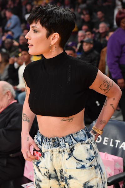 Halsey's subtle face tattoo at a basketball game between the Los Angeles Lakers and the Cleveland Ca...