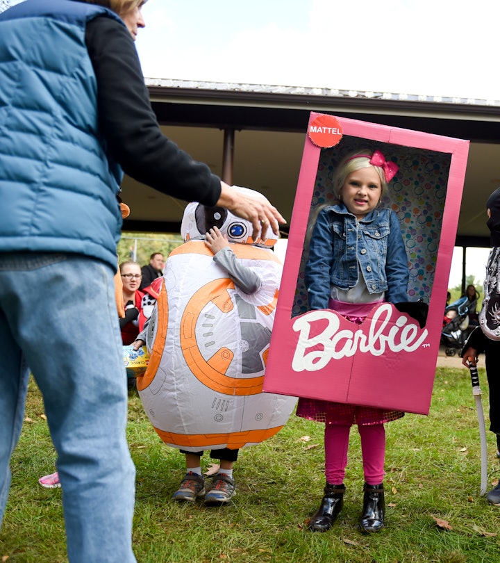 Jaylyn Bender (dressed as Barbie), 7, of Denver, waits for prizes in the costume contest during the ...
