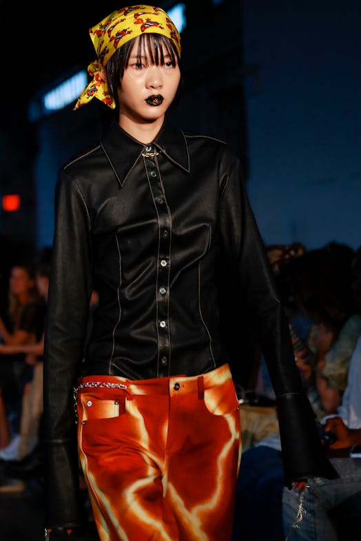 A model in black lipstick walked the runway at the PRISCAVera fashion show during September 2022 New...