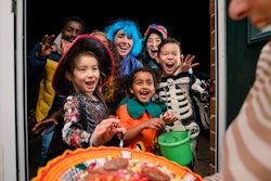 kids trick-or-treating, using halloween sayings to thank the person giving them candy