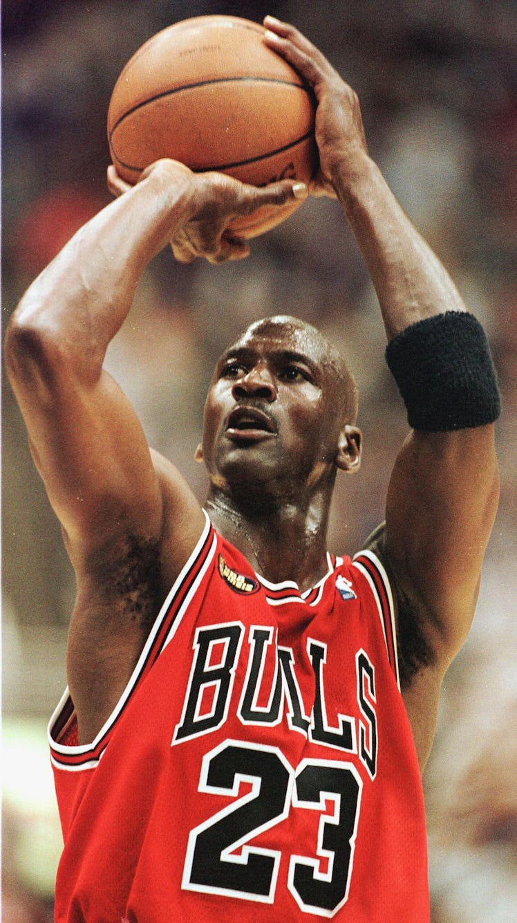 Michael Jordan of the Chicago Bulls takes a shot against the Utah Jazz 14 June during game six of th...