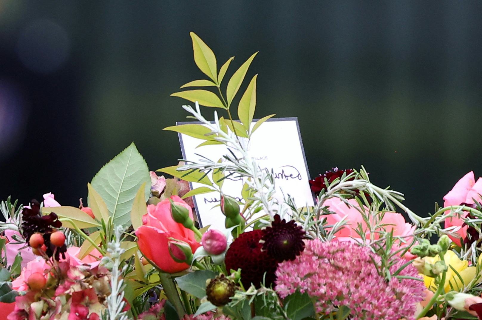 Flowers are seen atop the coffin of Queen Elizabeth II as it is carried into Westminster Abbey
