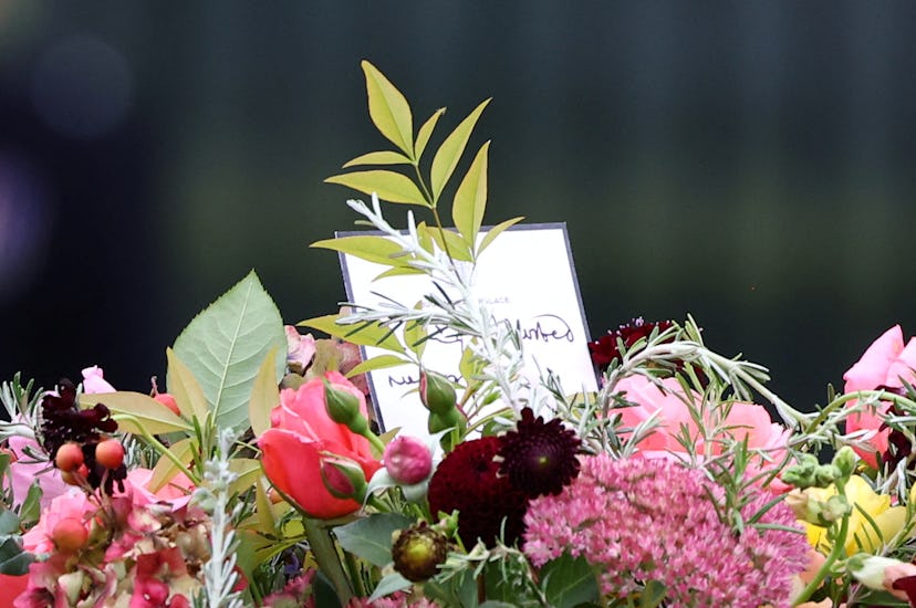 Flowers are seen atop the coffin of Queen Elizabeth II as it is carried into Westminster Abbey