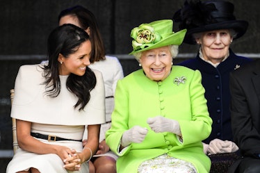 Meghan Markle wears earrings gifted to her by Queen Elizabeth as seen when Queen Elizabeth II sitts ...