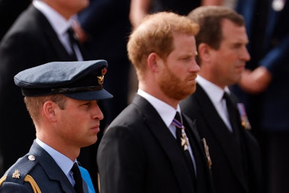 Britain's Prince William, Prince of Wales (L), Britain's Prince Harry, Duke of Sussex and Peter Phil...