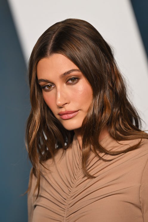 Hailey Bieber is a fan of overlining her lips. Here, a makeup artist who's worked with the model bre...