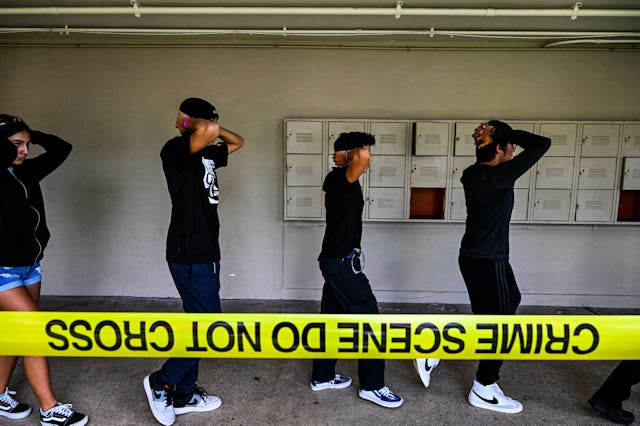 People participate in a Large-Scale Functional Active Shooter Drill, held by Miami-Dade Schools Poli...