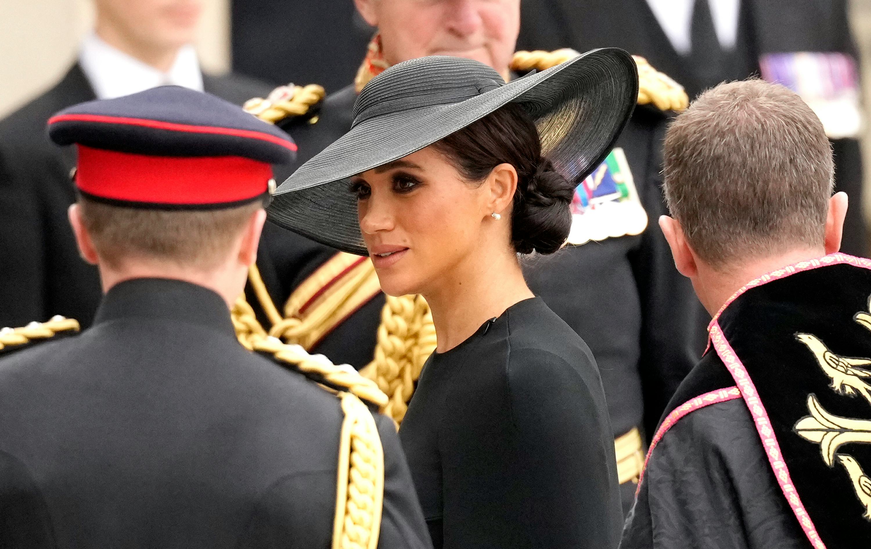 These photos of Meghan Markle and Prince Harry at Queen Elizabeth's funeral are touching.