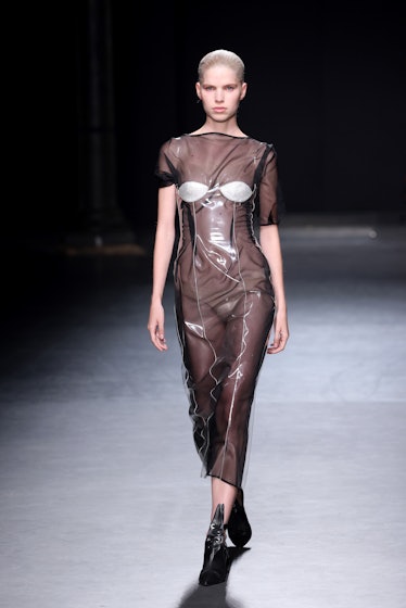 A model walking the runway in a see-through overall at the Christopher Kane show during London Fashi...