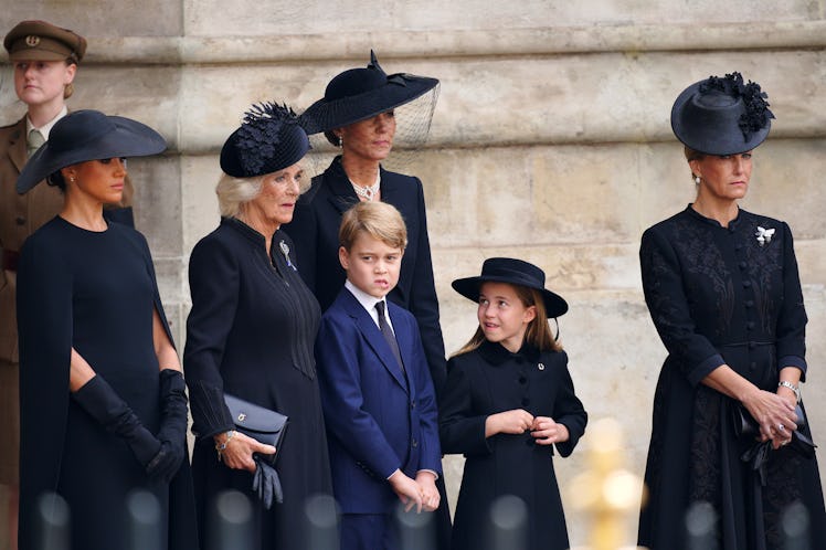 (left to right) The Duchess of Sussex, the Queen Consort, Prince George, the Princess of Wales, Prin...