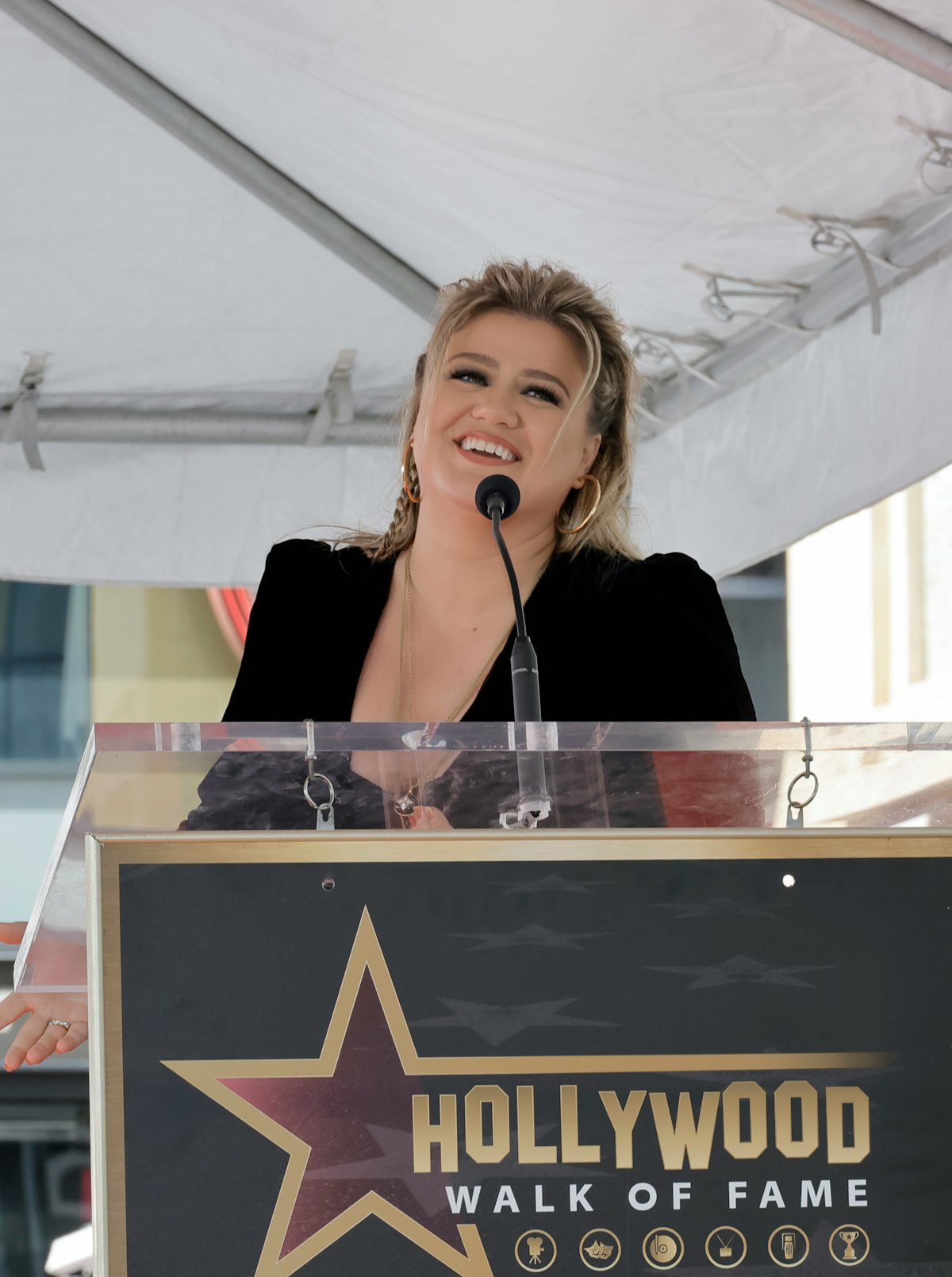 LOS ANGELES, CALIFORNIA - SEPTEMBER 19: Kelly Clarkson speaks onstage during her star ceremony on Th...