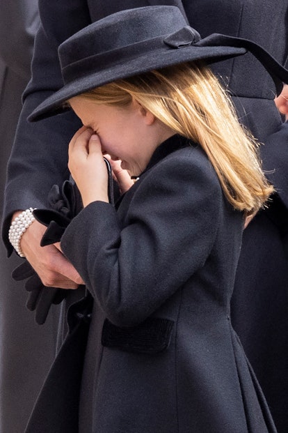 TOPSHOT - Britain's Princess Charlotte of Wales appears to cry next on September 19, 2022, during th...