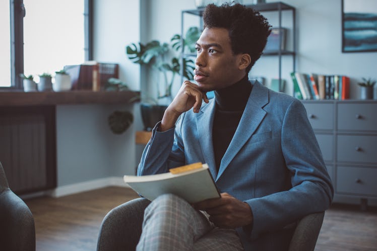 Young confident man at office on meeting.