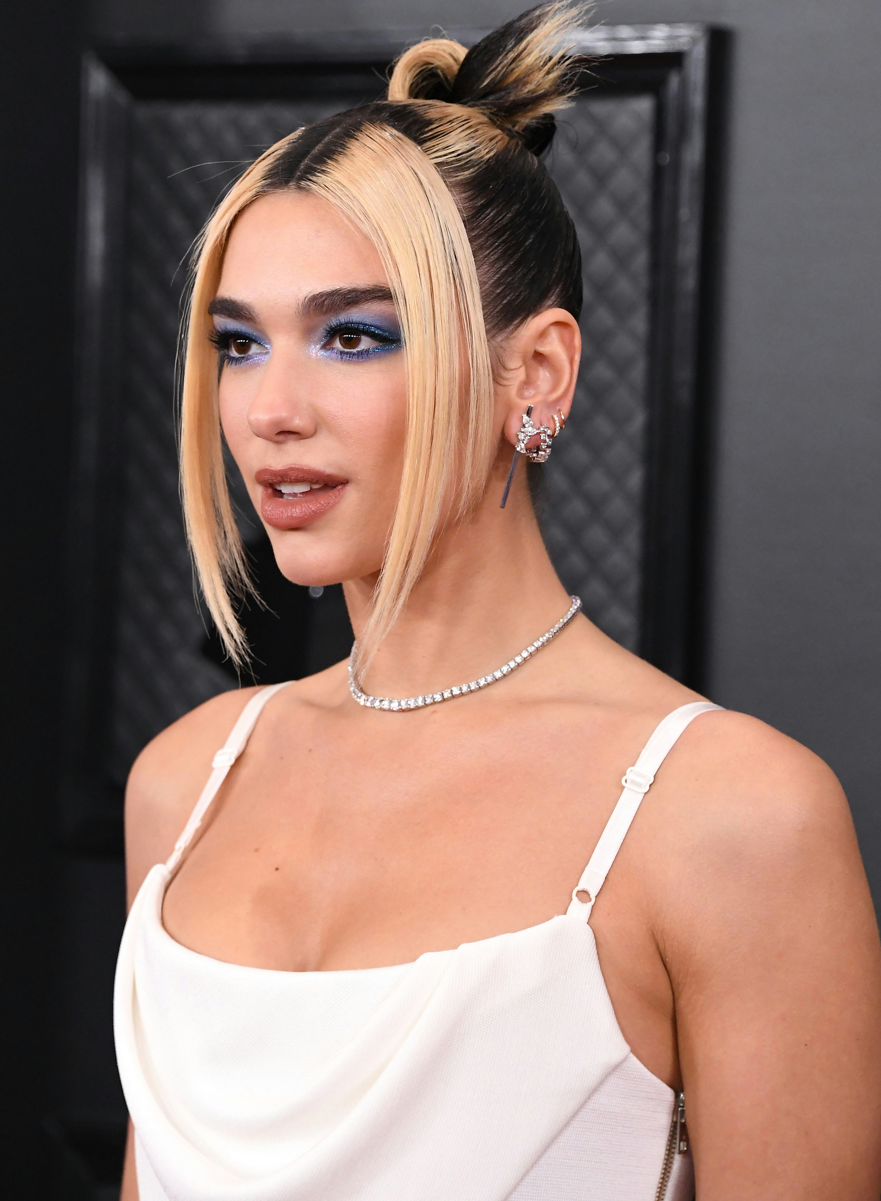 Dua Lipa wears a sleek topknot to the 62nd Annual GRAMMY Awards.