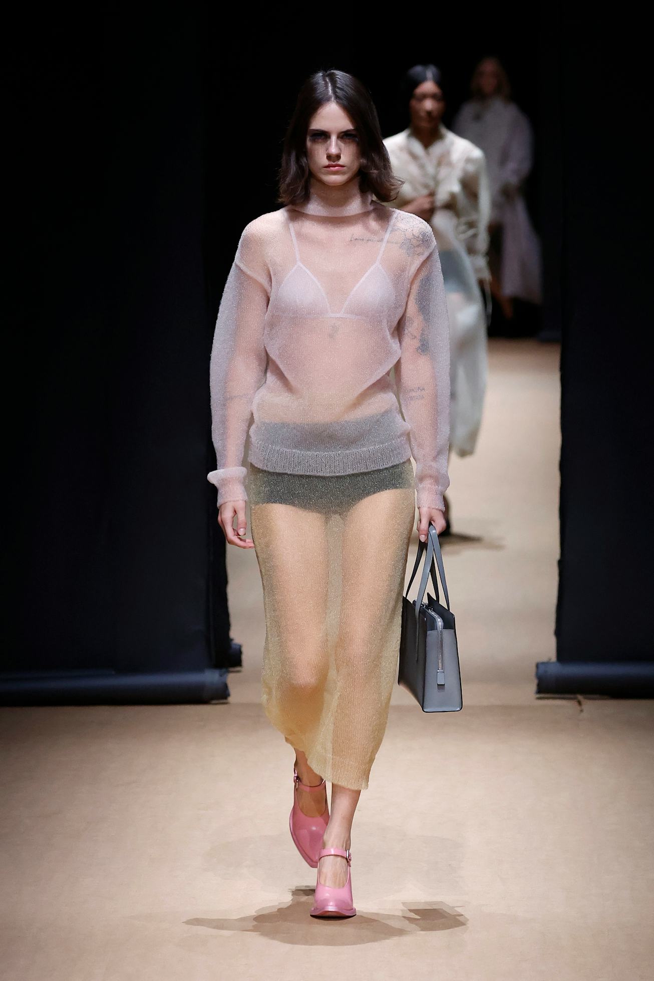 A model walks the runway at Prada. 